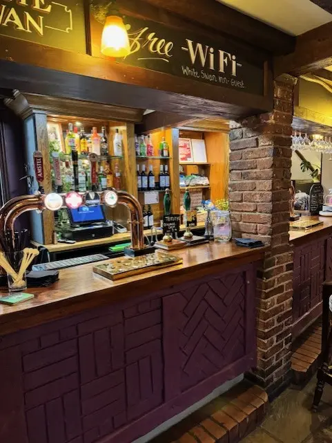 Bar area with guests socialising