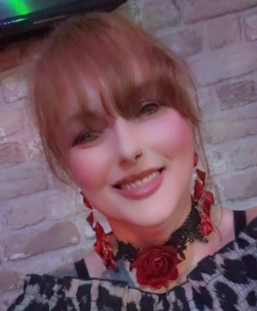 Front-of-house lead serving guests in the dining room